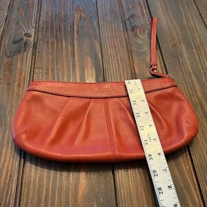 Coach orange clutch/wristlet